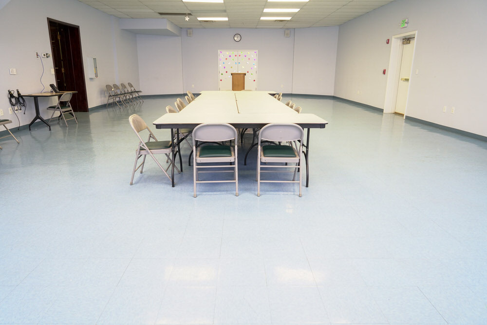 Govans meeting room - tables and chairs in the center