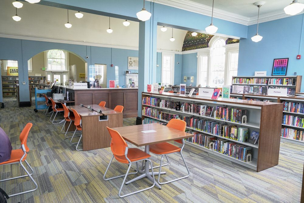 Hampden inside view with seating furniture and bookshelves