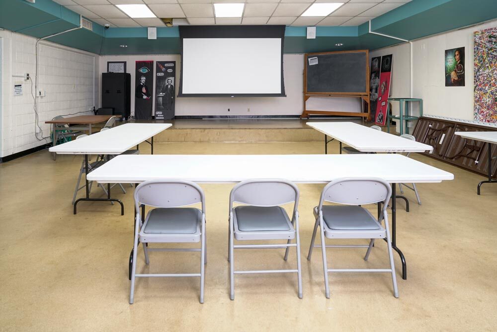 Light Street meeting room - 3 tables in a C shape and a projection screen