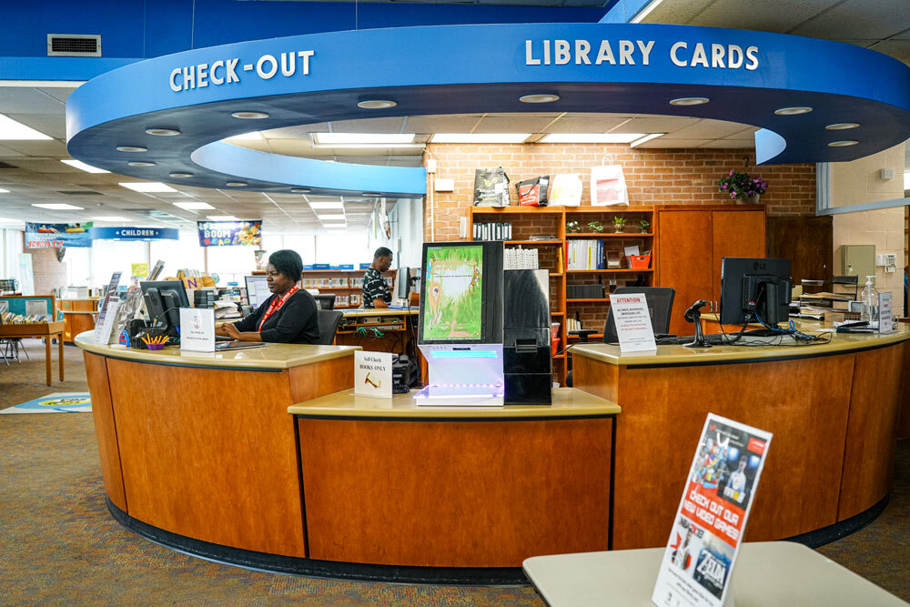 Northwood - staff at Check Out desk, and Library Cards sign