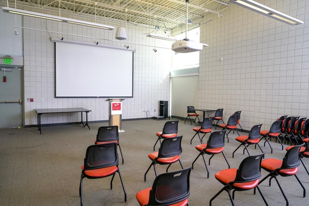Orleans meeting room with chairs and projection screen