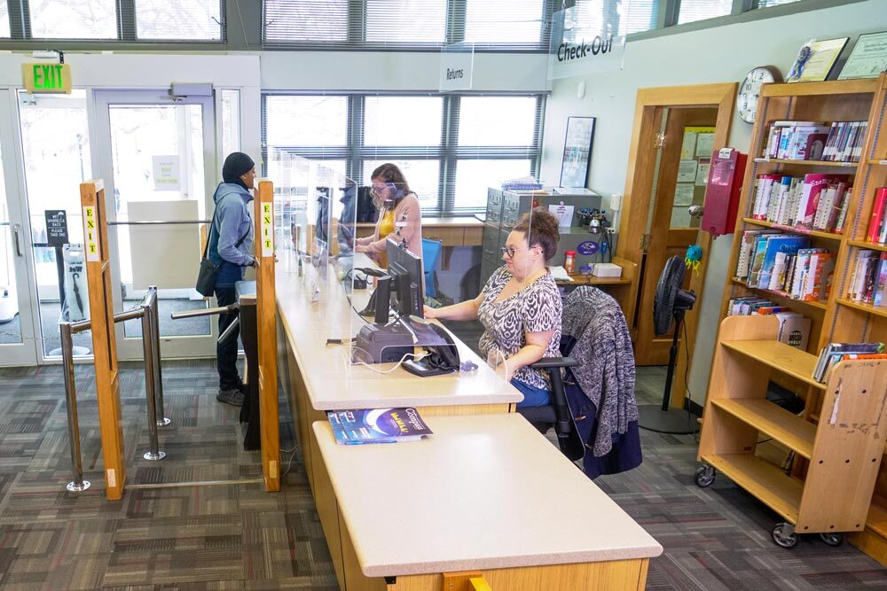 Patterson Park desk with staff helping a customer