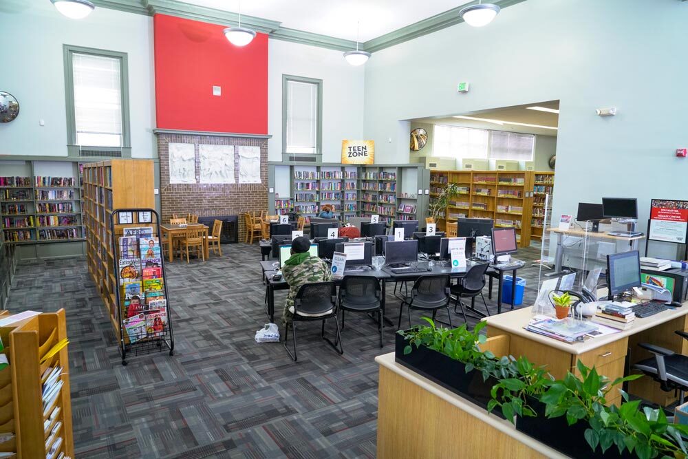 Patterson Park room showing the Teen Zone, computers, bookshelves, and magazines on display