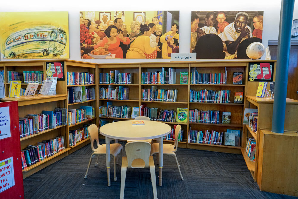 Pennsylvania Avenue - Fiction books, kids table and chairs, art on the walls