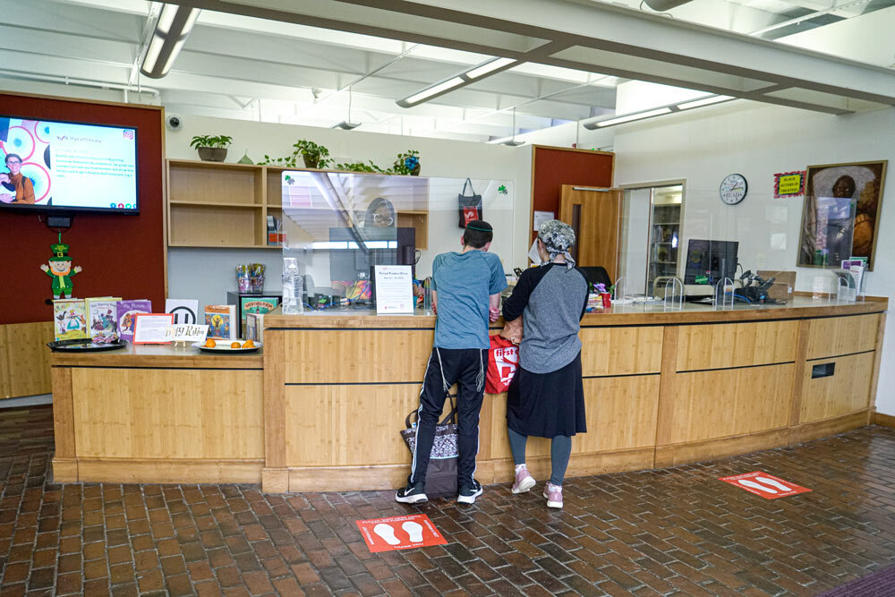 Reisterstown Road customers at the checkout desk