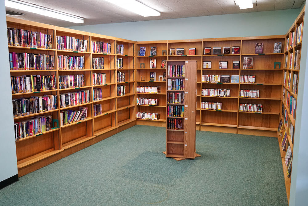 Walbrook media shelves with books, movies, and audio